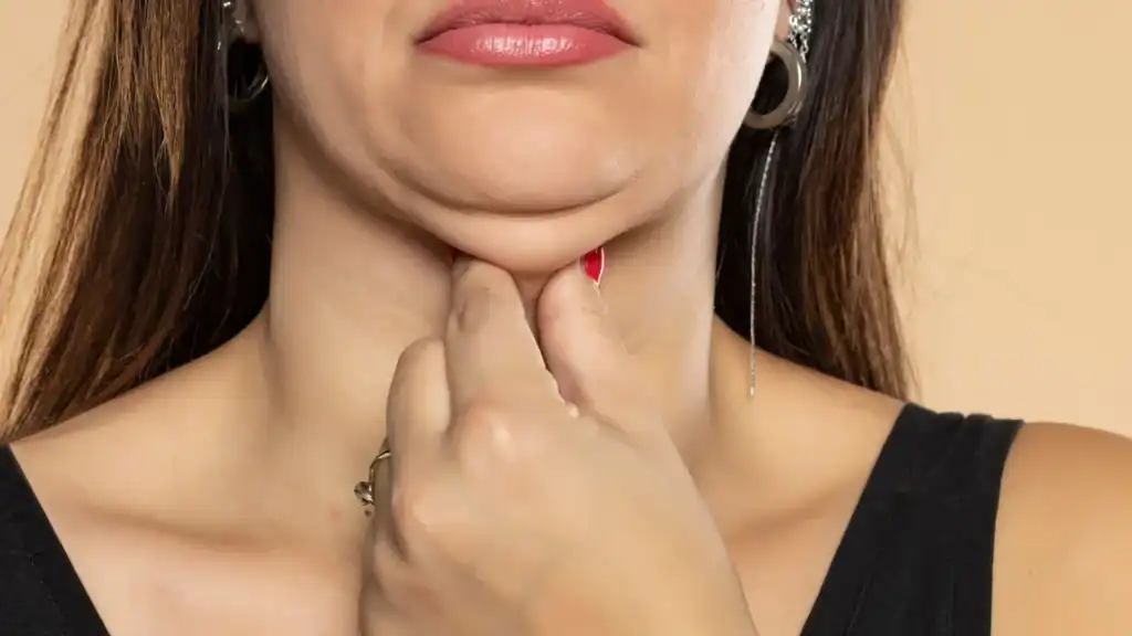 An image of a woman with double chin, sad, worried : Non Surgical Double Chin Removal Treatment in Haslemere, UK